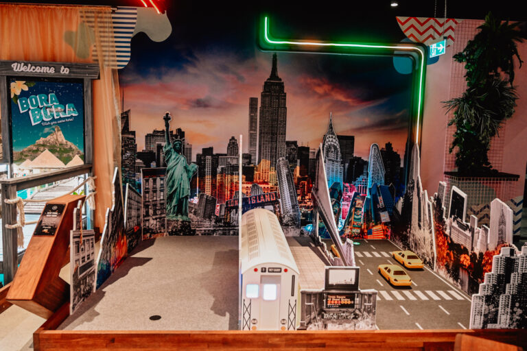 Street art themed mini golf hole with colourful graffiti mural at Hey Caddy