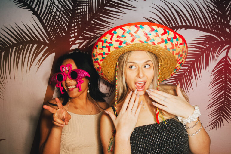 Friends using playful props at Hey Caddy South Bank event venue