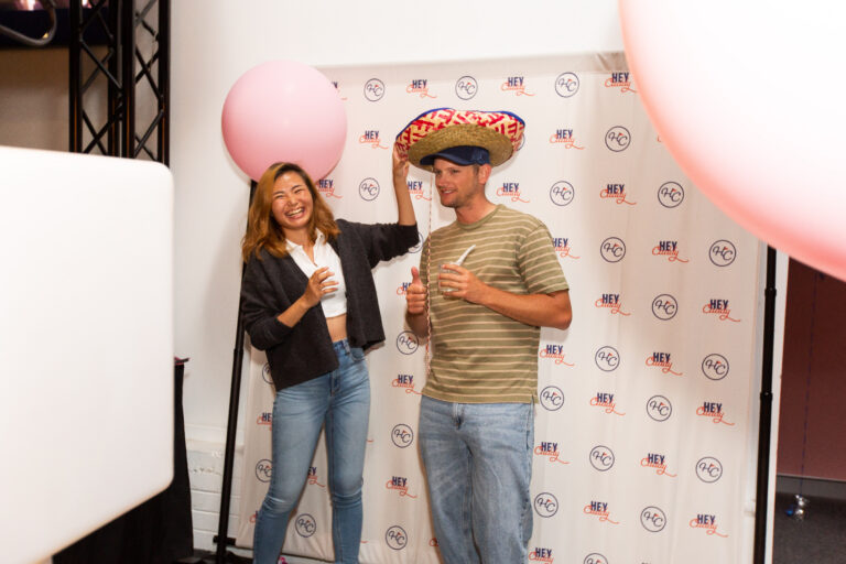 Guests posing at a Hey Caddy Balcatta event photo booth