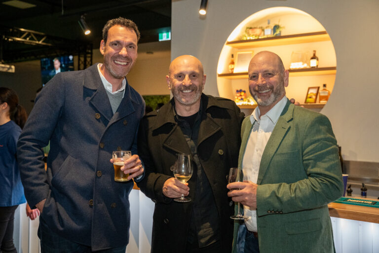 Guests enjoying drinks at Hey Caddy West Lakes indoor mini golf and bar venue