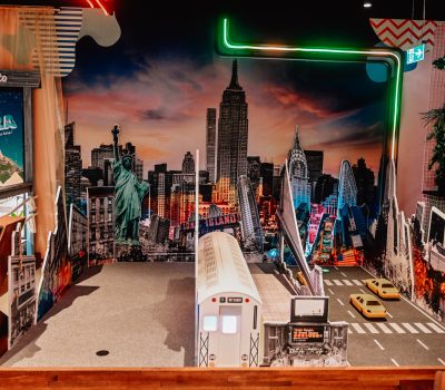 Street art themed mini golf hole with colourful graffiti mural at Hey Caddy