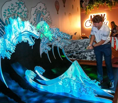 Hey Caddy Palmerston Mini Golf Darwin. Man Playing Golf Hole