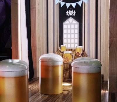 Beer themed mini golf hole with steins and festive decorations at Hey Caddy